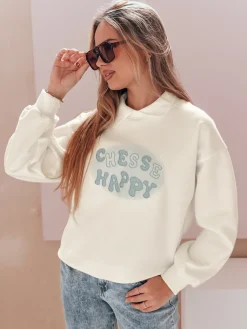 Bluzy Damskie>Dstreet Bluza damska oversize z nadrukiem HAPIRES biała BY1484