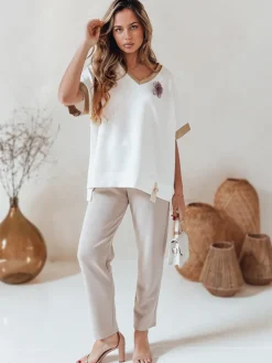 Spodnie Damskie>Dstreet Spodnie damskie masełko casualowe z kwiatami LEGISSA jasnobeżowe UY2404